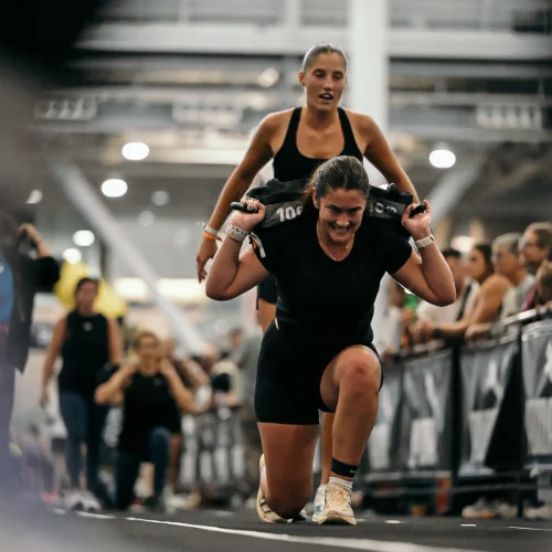 hyrox dobles sandbag lunges